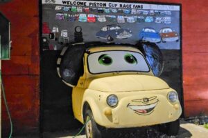 Luigi welcoming Piston Cup Race Fans