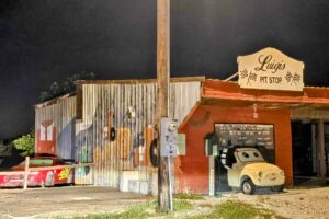 Luigi's Pit Stop with tractor tipping mural and Lightning McQueen