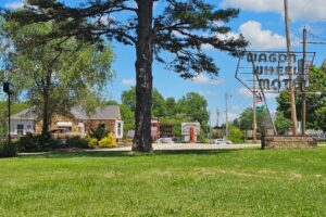Wagon Wheel Motel - Neon sign and an antique car by the office Wagon Wheel Motel - Neon sign and an antique car by the office