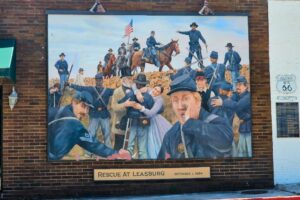 Rescue at Leasburg Oct 1, 1864 - The exhausted Federals arrived at Leasburg near dusk on the 29th and took shelter in a railroad cut, stacking cordwood and ties for protection. A continual fire was exchanged through the night and following day. On the morning of Oct 1, a lookout spotted a column of cavalry. As they drew near, the stars and stripes appeared-reinforcements from the Union garrison at Rolla. The Rebels gave up and moved on. General Ewing's command celebrated the end of their ordeal. Rescue at Leasburg Oct 1, 1864 - The exhausted Federals arrived at Leasburg near dusk on the 29th and took shelter in a railroad cut, stacking cordwood and ties for protection. A continual fire was exchanged through the night and following day. On the morning of Oct 1, a lookout spotted a column of cavalry. As they drew near, the stars and stripes appeared-reinforcements from the Union garrison at Rolla. The Rebels gave up and moved on. General Ewing's command celebrated the end of their ordeal.