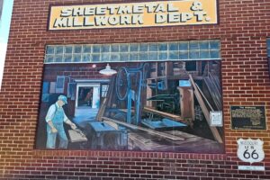 Sheetmetal & Millwork Dept - depicts the 1948 Roberts-Judson Lumber Company millworks building, the site of custom woodworking and sheet metal production. It remains one of the oldest continuing businesses in Cuba. Sheetmetal & Millwork Dept - depicts the 1948 Roberts-Judson Lumber Company millworks building, the site of custom woodworking and sheet metal production. It remains one of the oldest continuing businesses in Cuba.