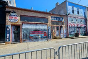 The back side of shops on the square have murals painted on them The back side of shops on the square have murals painted on them