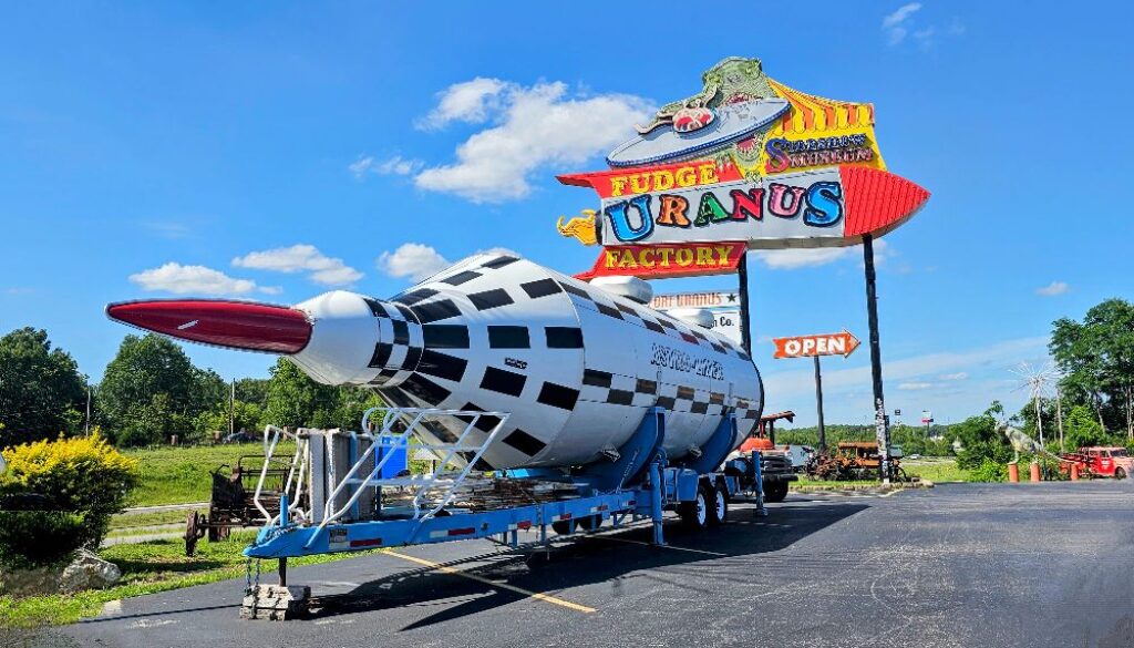 The famous Uranus sign with a giant rocket out front