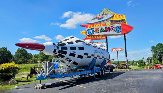 The famous Uranus sign with a giant rocket out front
