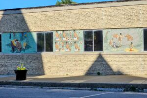 A tile mosaic mural depicting indigenous tribe scenes A tile mosaic mural depicting indigenous tribe scenes